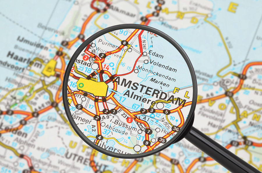 Tourist conceptual image: Destination - Amsterdam (with magnifying glass)
