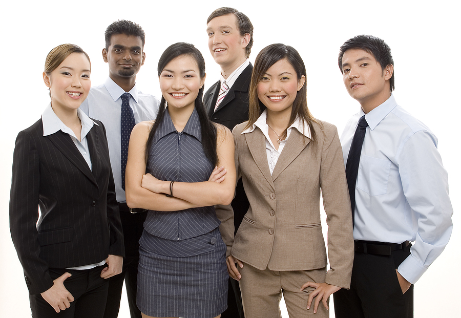 a group of diverse individuals make up a happy business team
